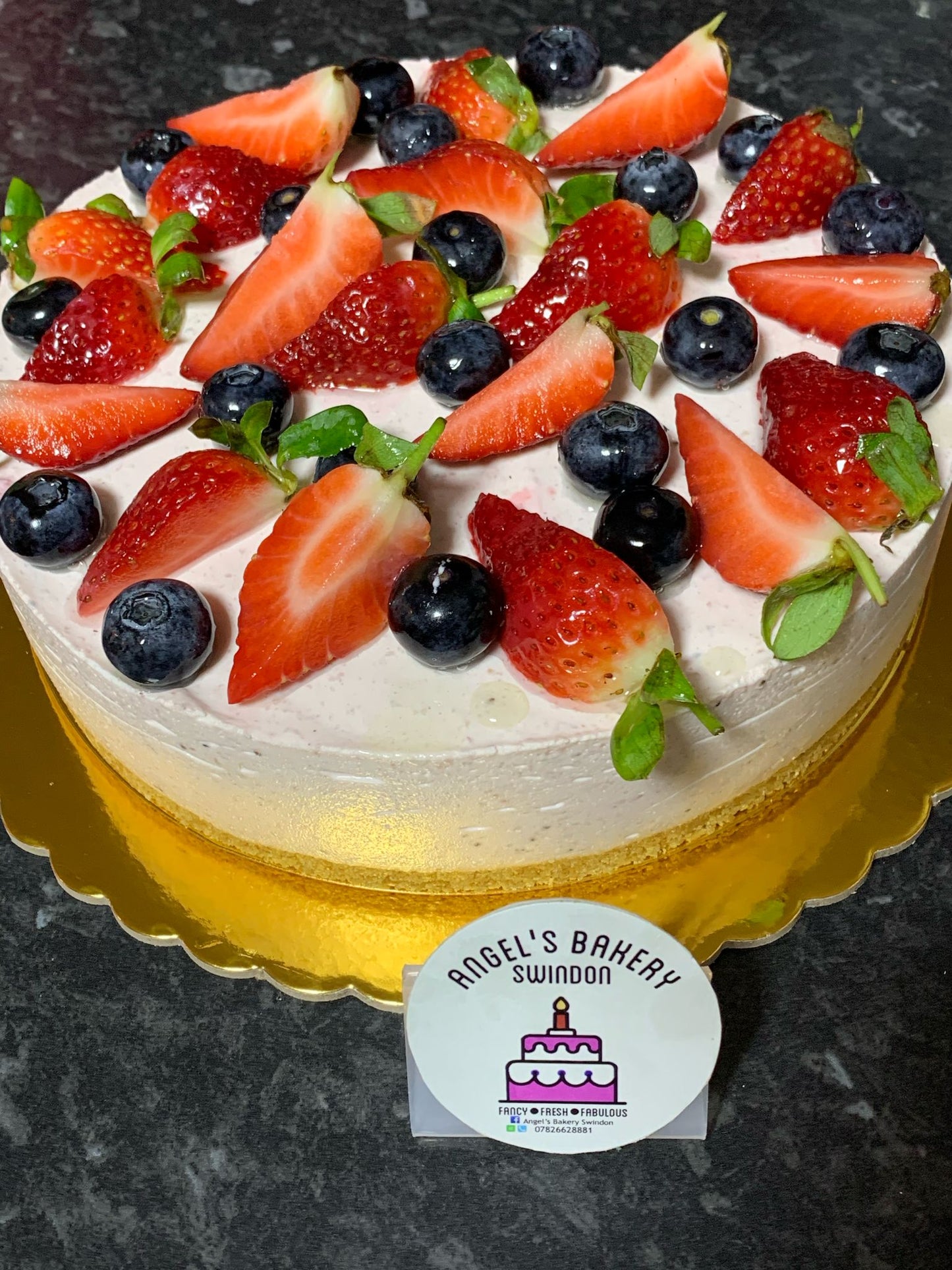 8" Strawberries Cheese Cake with strawberries and blueberries on top