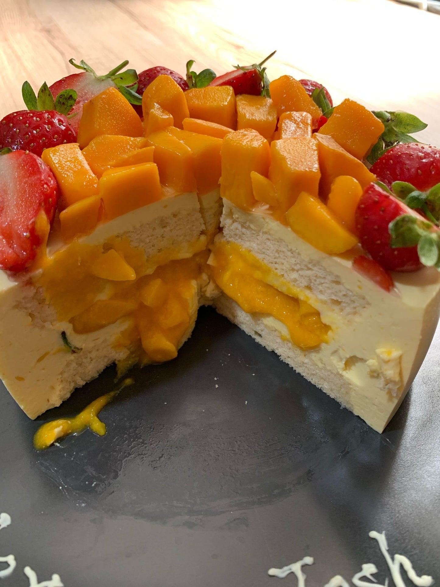 6" Mango Lava Cheese Cake with strawberries and mango on top