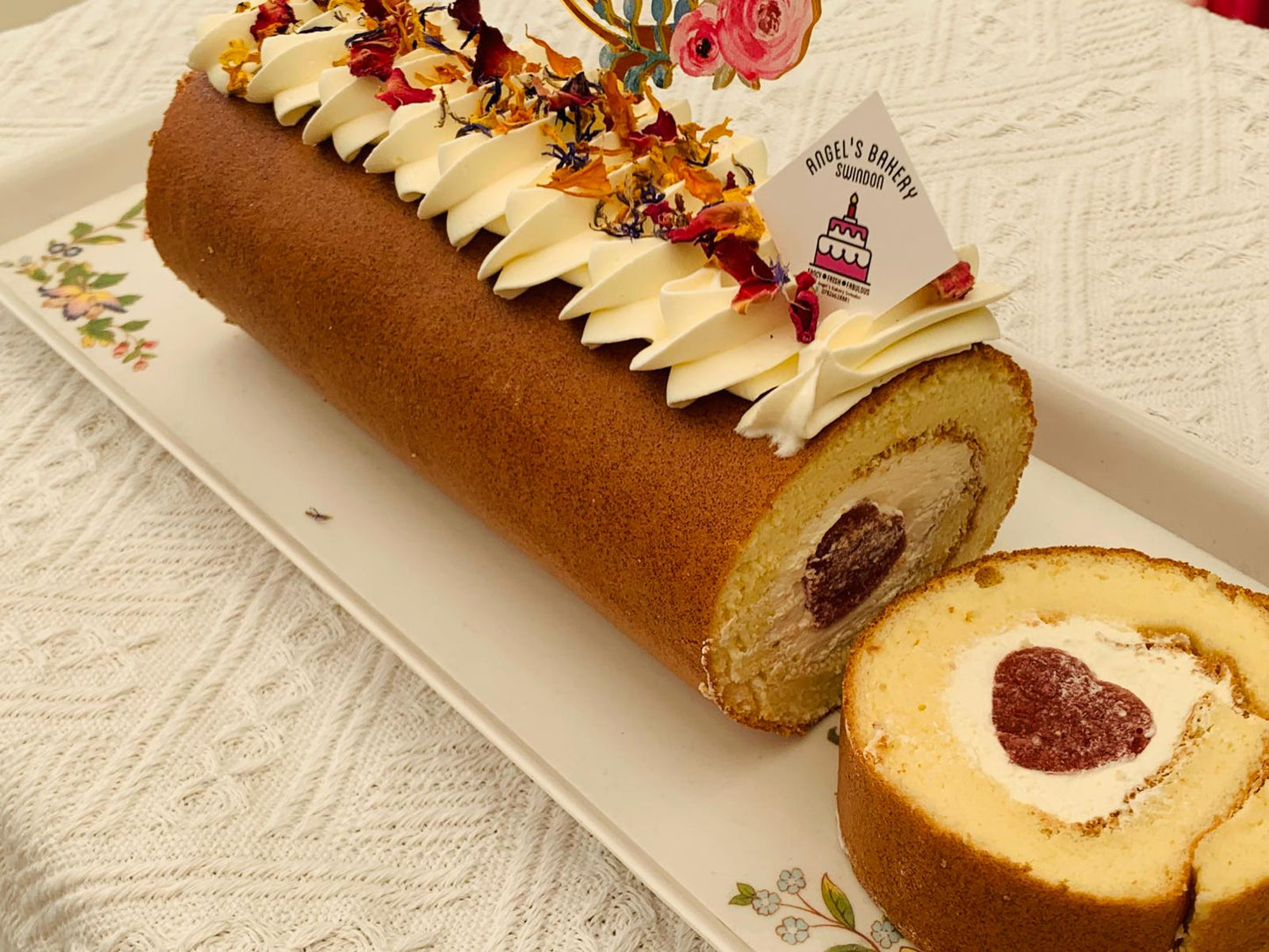 Swiss Roll with heart shape strawberries puree