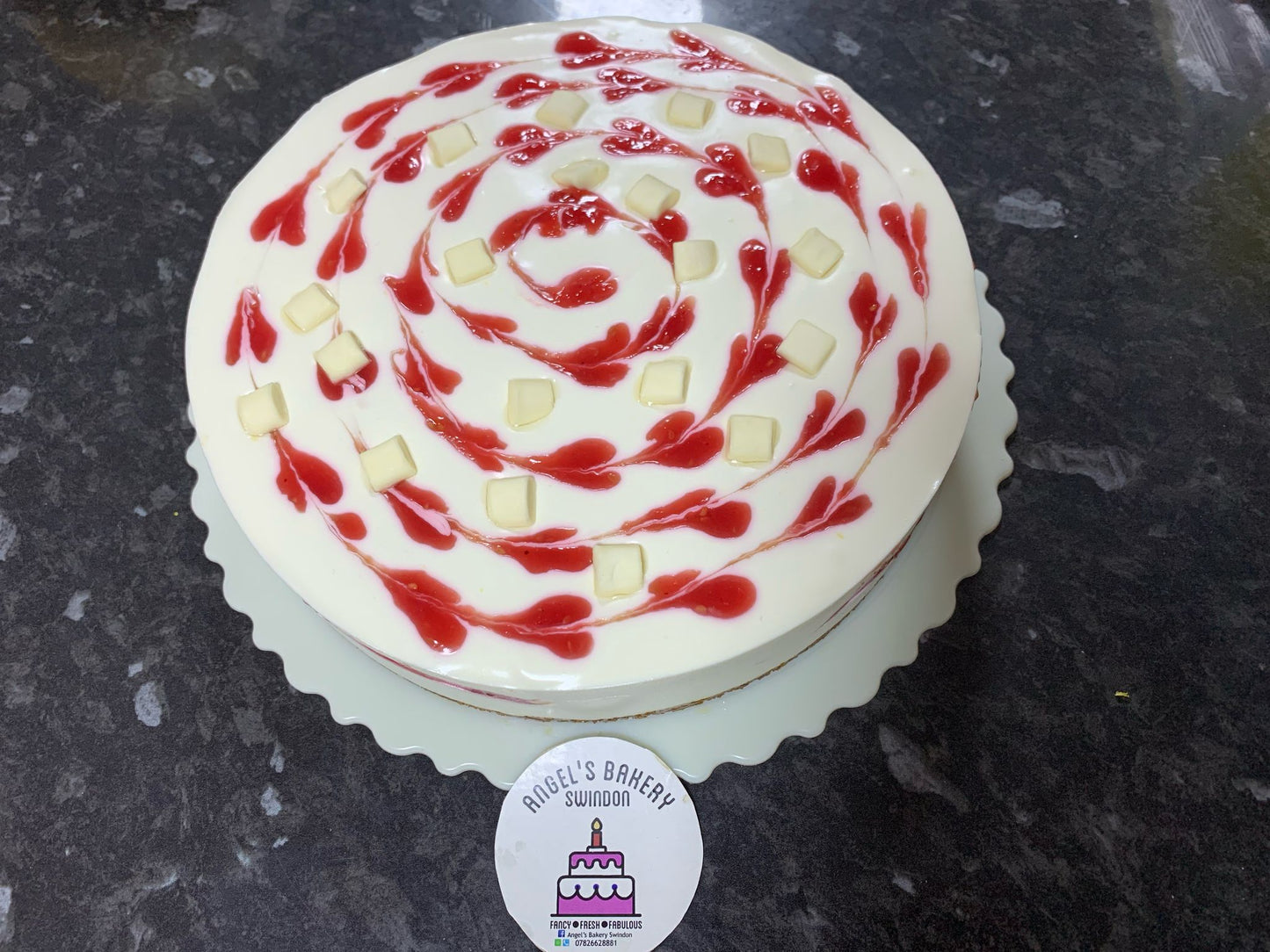 6" White Chocolate Cheese Cake with Jam and chocolate chunk on top